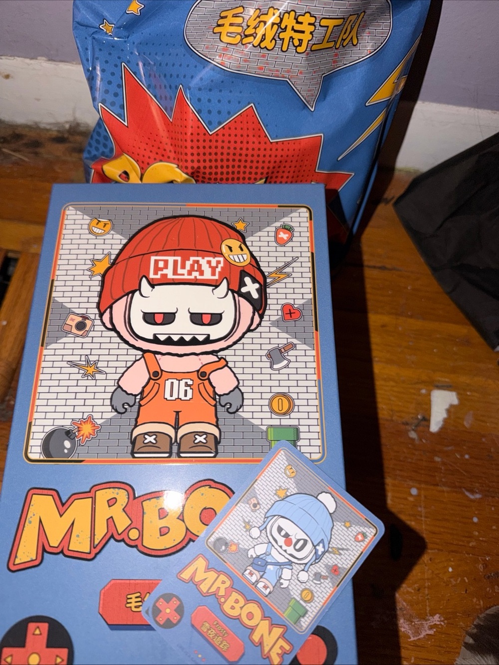 Mr. Bone Play Character Box - Blue & Red Graphic Packaging